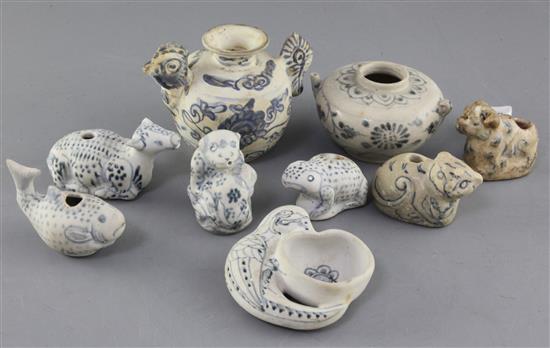 A group of nine Annamese blue and white water droppers, 15th century, all from the Hoi An shipwreck, length 5.5cm - 12cm